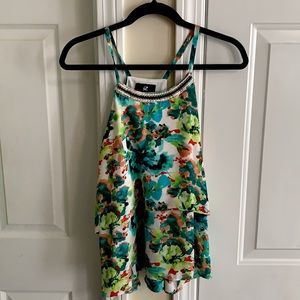 Floral tank top with beaded strip at neck line.